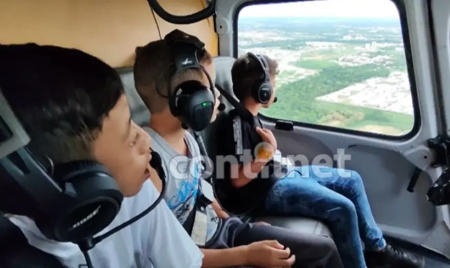 Gladson atende sonho de crianças com deficiência e elas fazem voo de helicóptero